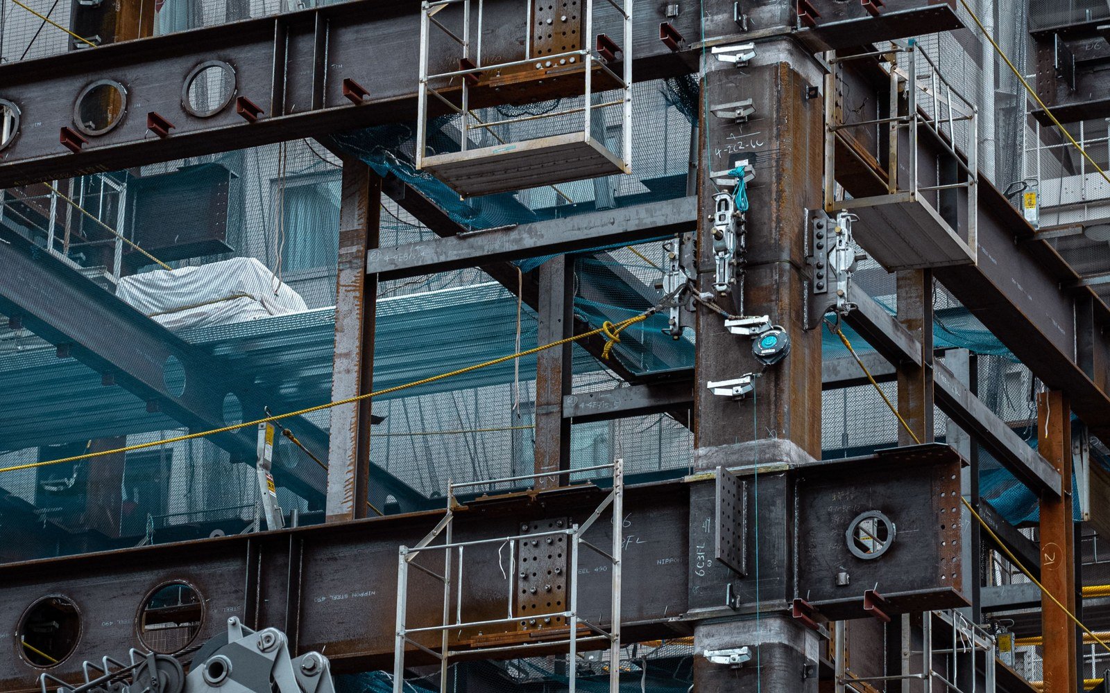 Steel beams and temporary edge protection inside a building under construction