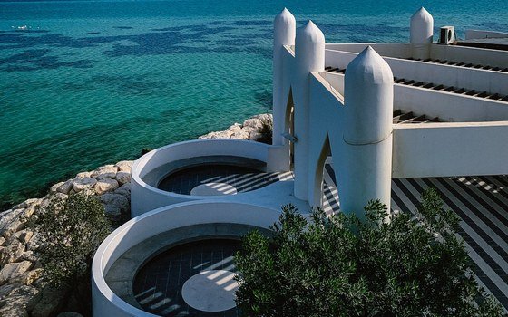White coastal buildings on the Al Khobar seafront with the sea behind