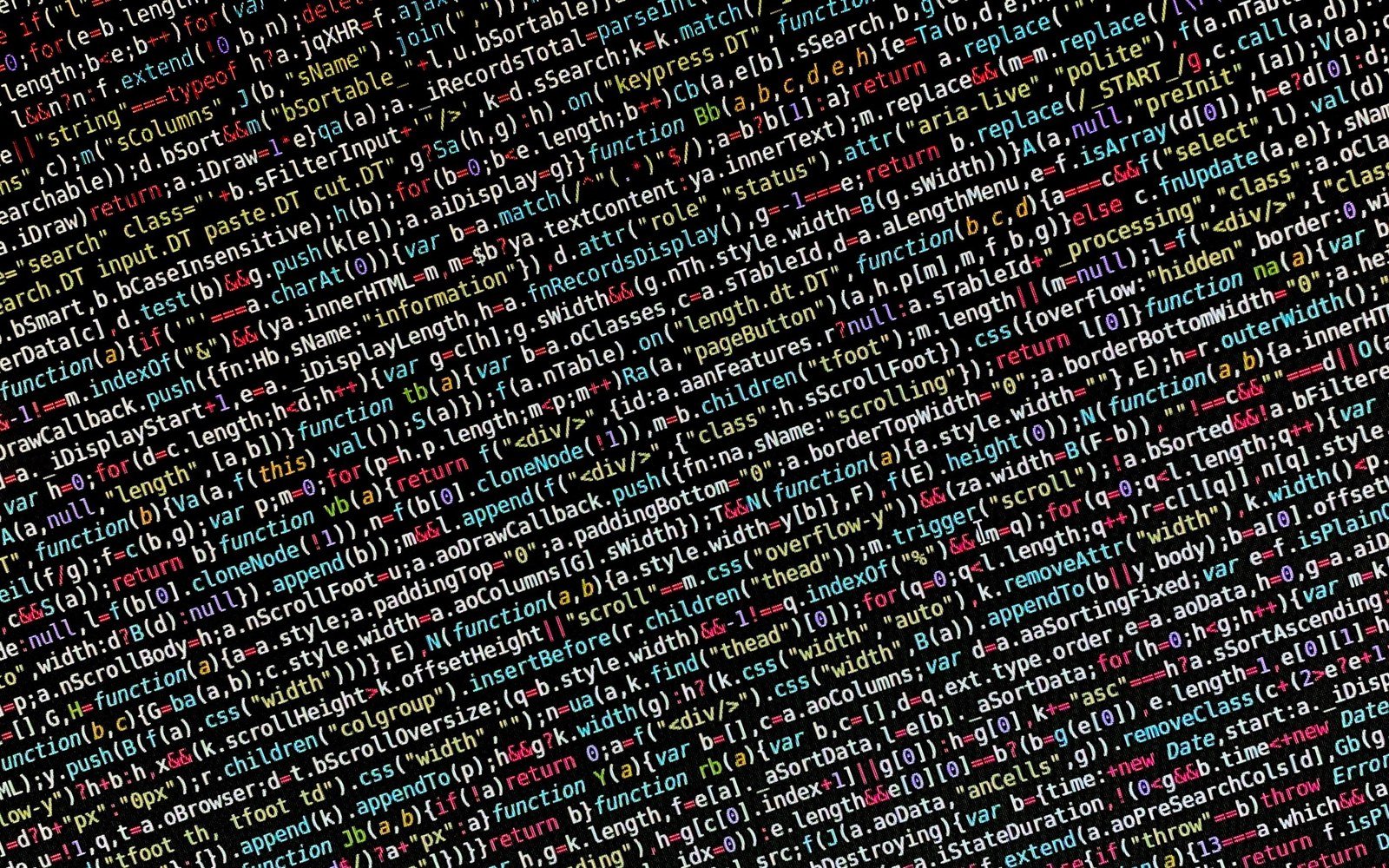 A screen filled edge to edge with dense minified source code in several colours on a black background