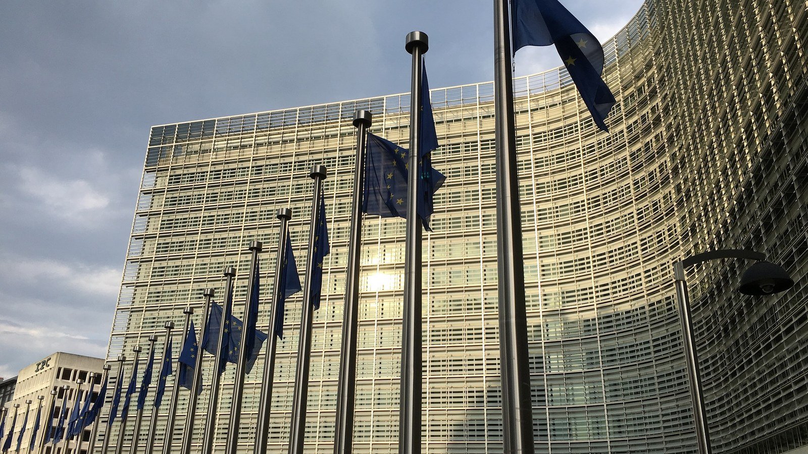 The Berlaymont building in Brussels with European Union flags outside