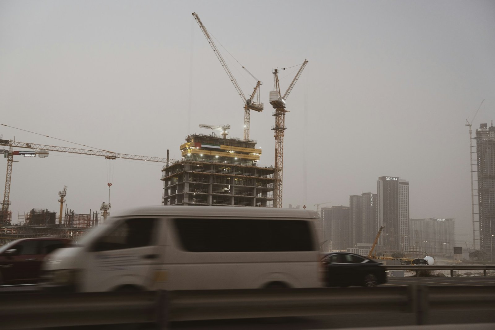 Construction cranes and traffic in Dubai