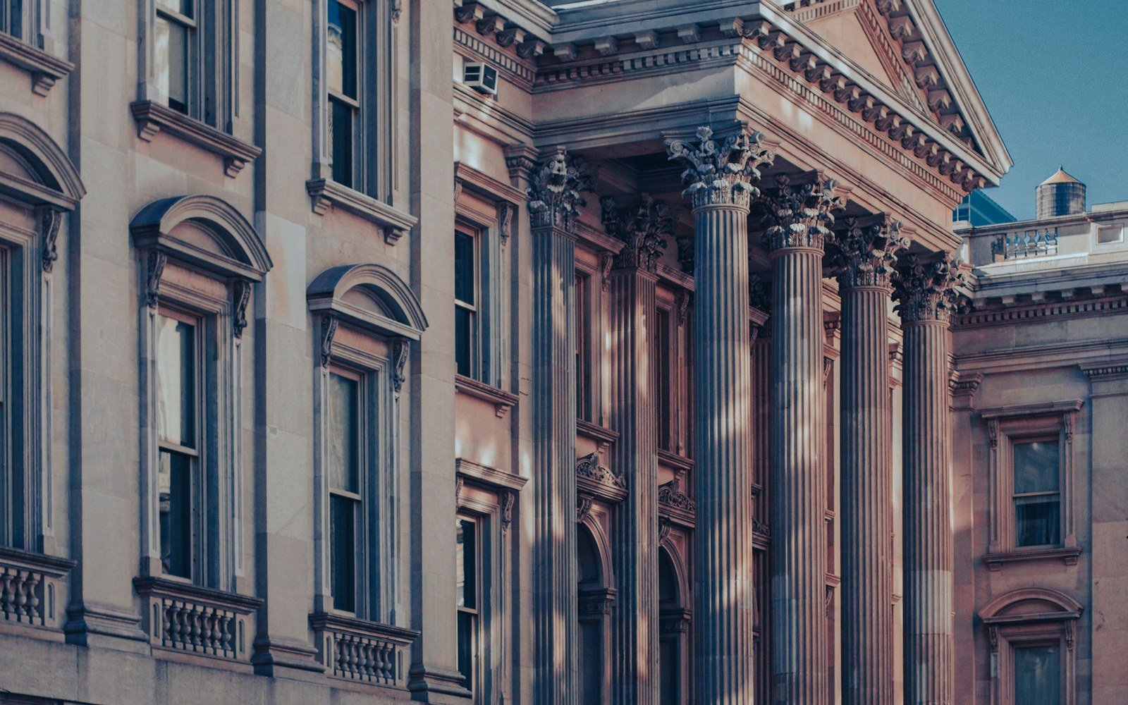 A neoclassical courthouse facade with a columned portico in Manhattan
