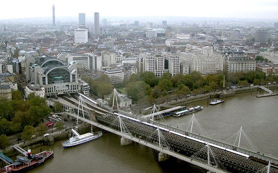 Hungerford Bridge carrying railway tracks across the Thames into Charing Cross station in London