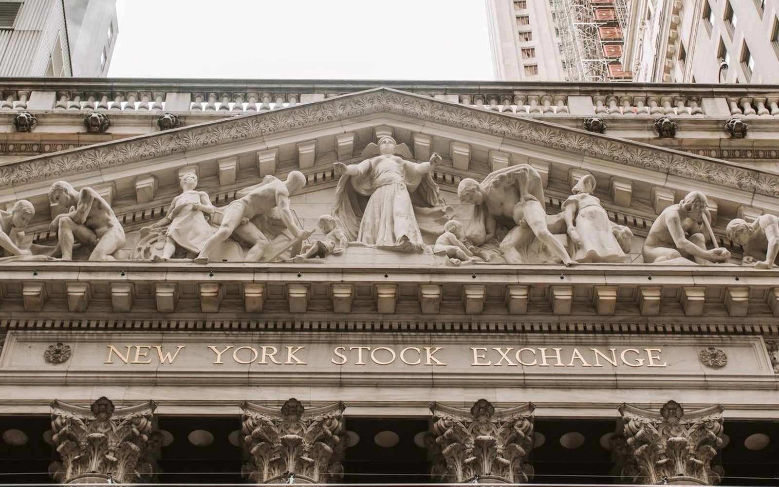 The carved pediment and sculpted frieze above the columns of the New York Stock Exchange building