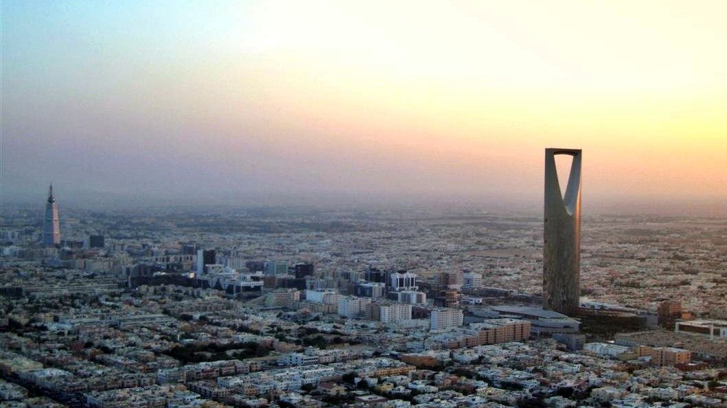 The Riyadh skyline at dusk with the Kingdom Centre tower