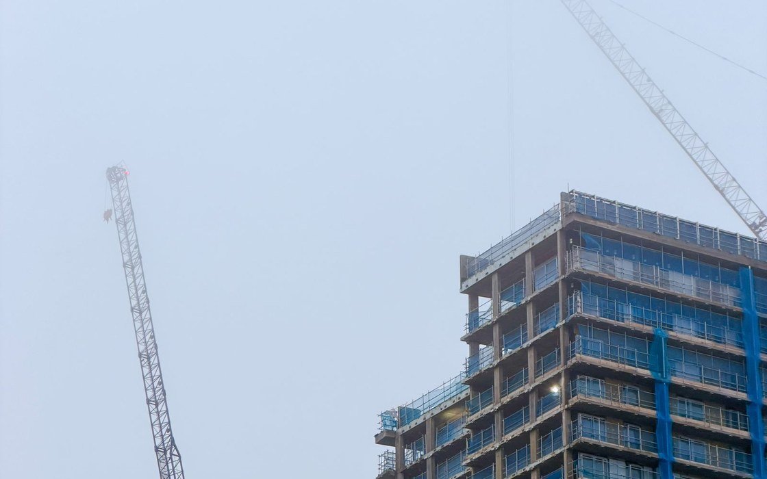 Tower cranes beside a high rise building under construction in Birmingham