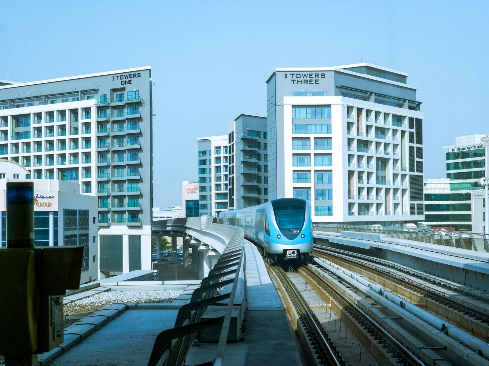 Dubai Metro train passing city towers