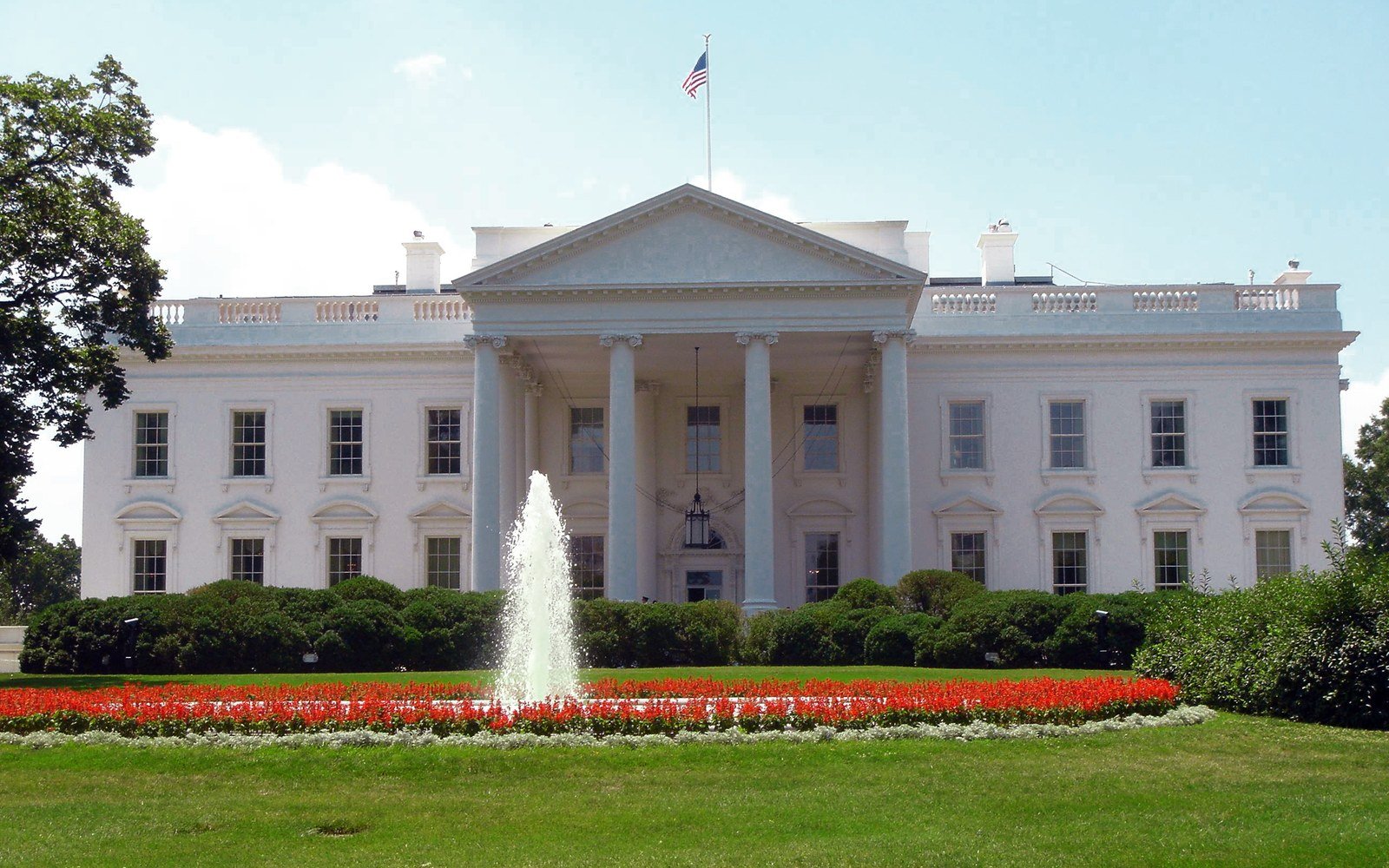 The north front of the White House behind its fountain and flower beds