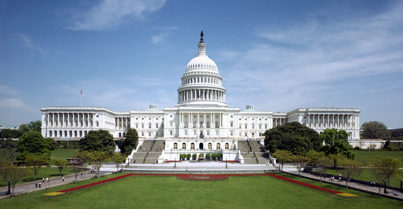 The west front of the United States Capitol under a blue sky