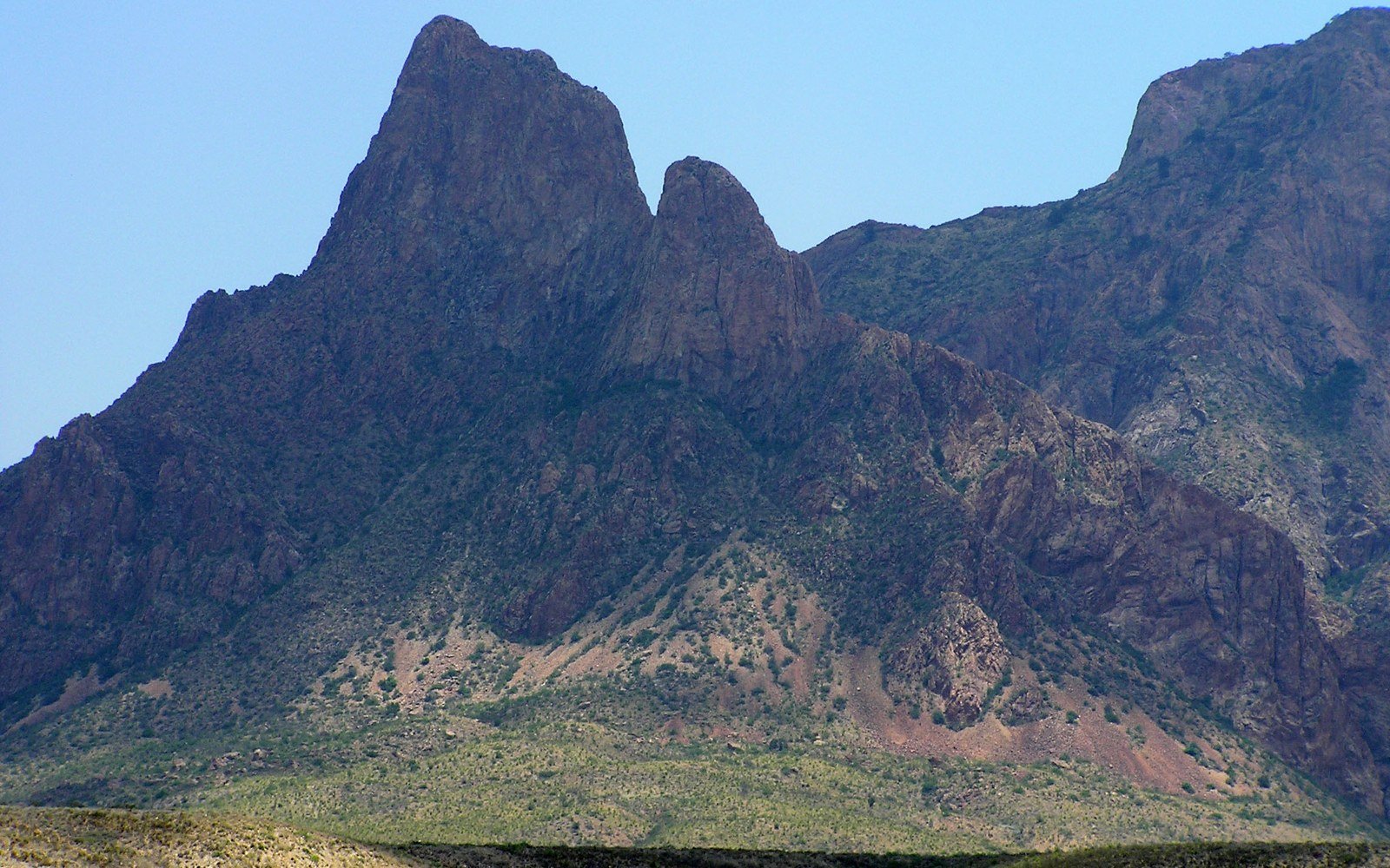 The Chisos Mountains rising above desert scrub in Big Bend National Park in Texas